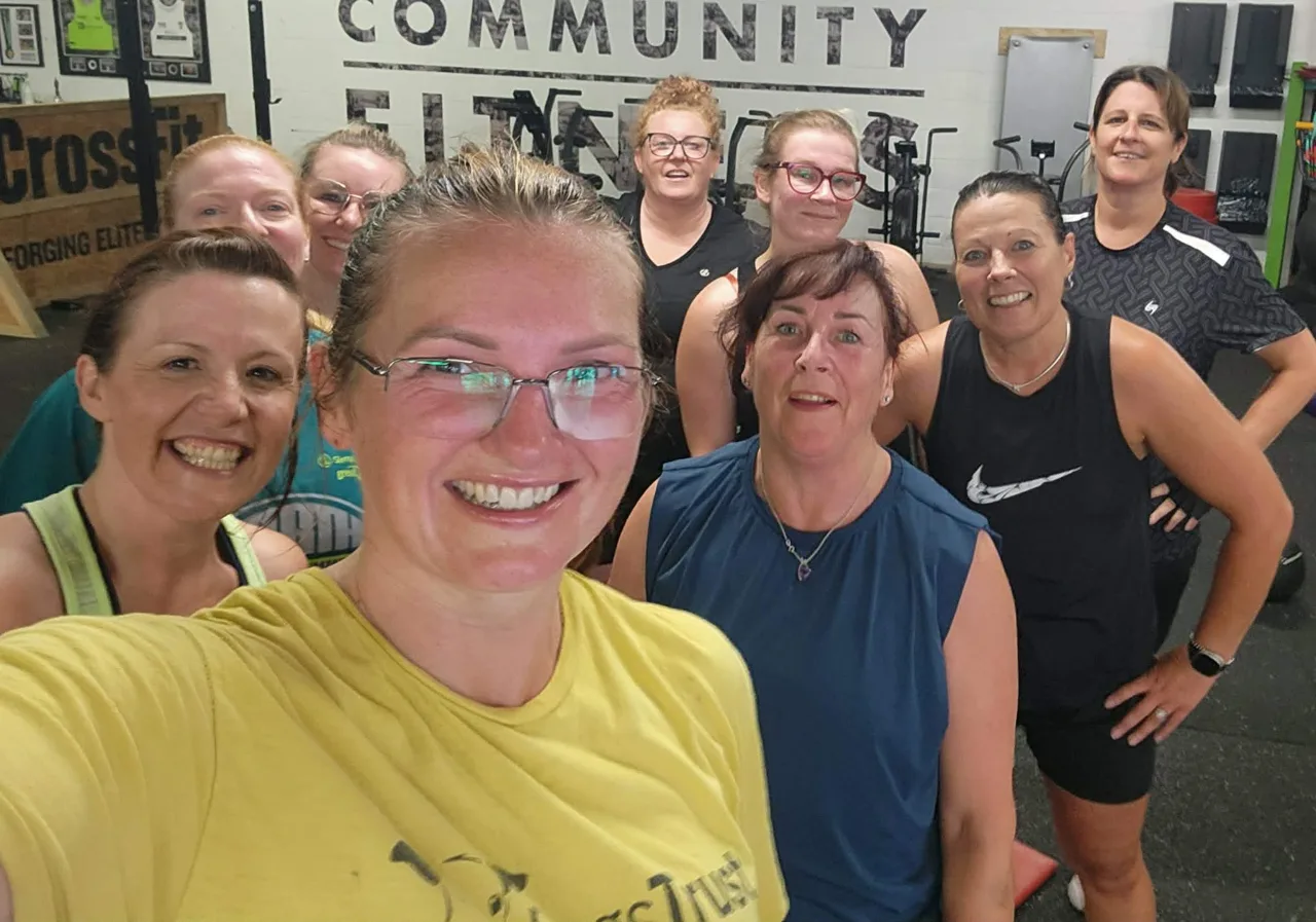 A smiling group of Phoenix members taking a selfie