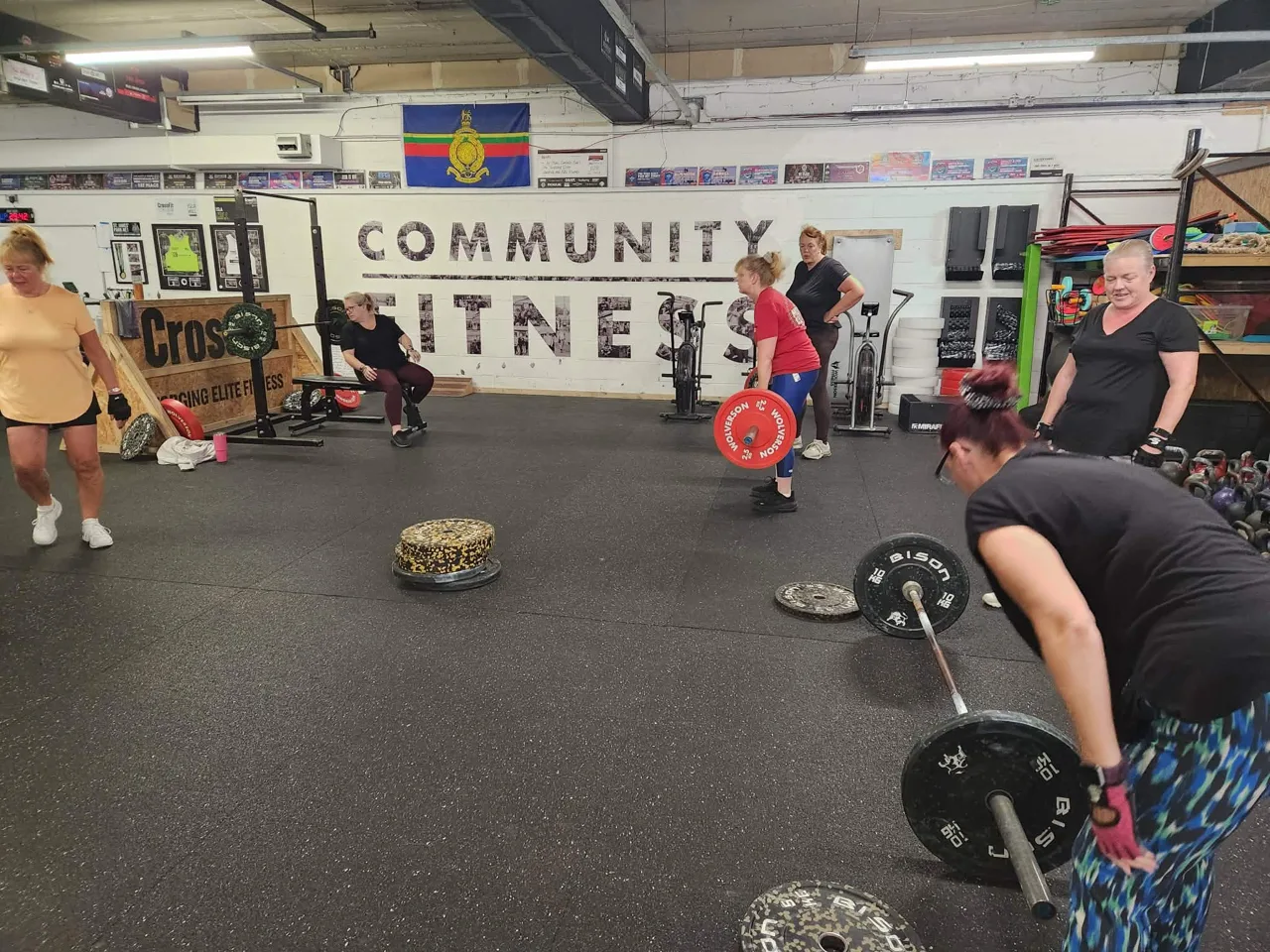 Phoenix women training with weights in the shared gym